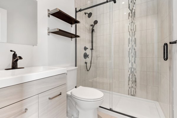 Walk - In Shower - Accessible Comfort: Tub-to-Walk-In Shower Conversion

This custom tub-to-walk-in shower conversion was designed with safety and independence in mind. For an elderly homeowner, we replaced the traditional tub with a spacious, low-threshold shower to make daily bathing safer and easier. Equipped with strategically placed grab bars for extra stability, and a handheld shower head for full control, this upgrade ensures maximum comfort and accessibility, allowing for peace of mind every time they step in.