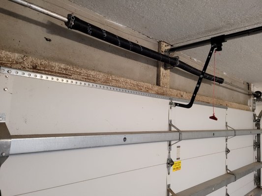 Garage Door Broken Springs Replacement - The left spring is old and rusty. The customer heard loud "snap" sounds and realized the garage door spring is broken.
When springs are broken it's impossible to open the door. (If you have broken spring - make sure not to press the opener - its can ruin the garage door opener as well).
A new ,same size were installed! All our springs are high quality Made-in-Canada. The new springs have a lifespan of 15,000 cycles (appx 10 years).
The installation of springs takes about 30 minutes. Garage Door Broken Springs Replacement - The left spring is old and rusty. The customer heard loud "snap" sounds and realized the garage door spring is broken.
When springs are broken it's impossible to open the door. (If you have broken spring - make sure not to press the opener - its can ruin the garage door opener as well).
A new ,same size were installed! All our springs are high quality Made-in-Canada. The new springs have a lifespan of 15,000 cycles (appx 10 years).
The installation of springs takes about 30 minutes.