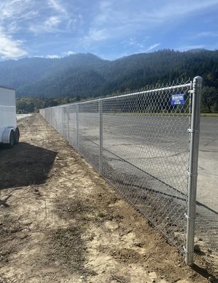 Commercial Chain Link Fence - We installed 450 feet of 6' tall commercial grade chain link providing security and safety to the municipal airport. Commercial Chain Link Fence - We installed 450 feet of 6' tall commercial grade chain link providing security and safety to the municipal airport.