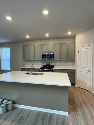 Kitchen cabinet painting - This dark colored kitchen took an Epic Transformation