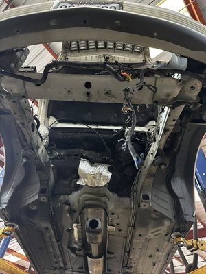 Timing chain replacement - Customer came in for noise diagnosis for a 2005 Cadillac DeVille . Our specialist found the noise coming from timing chain , in this picture our technician has removed transaxle assembly which includes engine. From there they will replace the timing chains on vehicle to get this vehicle back on the road and running!