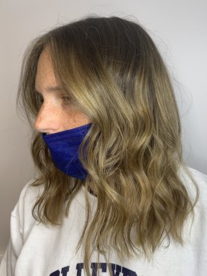 Natural balayage transformation - The goal was to create natural placement and a seamless blend. To achieve this look we did a full head of balayage placement and finished it off with a textured beachy style.