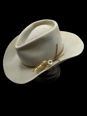 Custom Rabbit Fur Felt Hat - Every hat start from a "hat body" and is blocked to your hat size. After we block the hat, we pounce or sand the hat to create a velvety smooth finish. After the sweatband is sewn in, it's time to come in for your custom hat experience! During your experience we will shape the crown and brim to your specifications (teardrop, gus, cattleman, etc). After your hat is shaped, you can choose from a variety of trimmings and embellishments. We can distress your hat with fire for a more "lived-in" look, sew a bow, add leather cord, brand your initials, and more. Custom Rabbit Fur Felt Hat - Every hat start from a "hat body" and is blocked to your hat size. After we block the hat, we pounce or sand the hat to create a velvety smooth finish. After the sweatband is sewn in, it's time to come in for your custom hat experience! During your experience we will shape the crown and brim to your specifications (teardrop, gus, cattleman, etc). After your hat is shaped, you can choose from a variety of trimmings and embellishments. We can distress your hat with fire for a more "lived-in" look, sew a bow, add leather cord, brand your initials, and more.