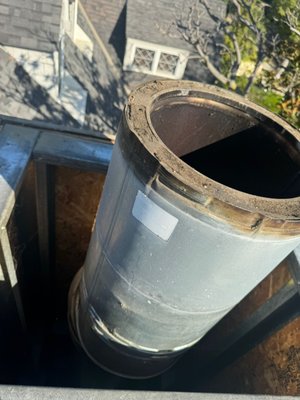 Shimmy repair and smoke chamber charging - This chimney was worked on last 30 years ago after the big earthquake after a camera inspection, we found out that some repairs are needed where the chimney was Retrofit from Masonary brick chimney with a clay liner with a transition code to a stainless steel pipe. High cement reinforcement was needed around the transition cone we opened up the top cover exposed the metal framing removed the stainless steel pipe repaired with high cement damaged area and put everything back together. We also brought the smoke chamber up to code by smoothing it with a layer of high heat cement Shimmy repair and smoke chamber charging - This chimney was worked on last 30 years ago after the big earthquake after a camera inspection, we found out that some repairs are needed where the chimney was Retrofit from Masonary brick chimney with a clay liner with a transition code to a stainless steel pipe. High cement reinforcement was needed around the transition cone we opened up the top cover exposed the metal framing removed the stainless steel pipe repaired with high cement damaged area and put everything back together. We also brought the smoke chamber up to code by smoothing it with a layer of high heat cement