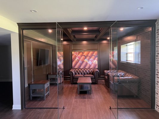 Basement Remodeling - Cigar Room - This project consisted of a full basement remodel. The basement was gutted, framed, and finished with drywall, and a custom cigar room was created. A new bar area was installed next to the cigar room, along with a new bathroom and closet.