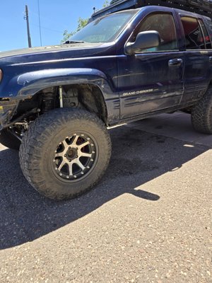 Jeep Grand Cherokee - This jeep needed all new suspension and a lift kit so with confidence the customer could take it off pavement when traveling across the United States. He had zero problems and returned to tell us all about it. Jeep Grand Cherokee - This jeep needed all new suspension and a lift kit so with confidence the customer could take it off pavement when traveling across the United States. He had zero problems and returned to tell us all about it.