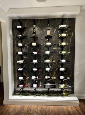 Marble BLACK LEVANTO | Marble Black Levanto - WINE WALL CELLAR: Unique wall-mounted racks featuring modern wine racks. If you're an avid wine collector, investing in dedicated storage space can be worth it. Beautiful art and design by our team. It's a perfect combination between designer and fabrication, Luxiomer and Renovva created one of the best projects, simple and elegant. We used marble Black Levanto. For more about this beautiful slab, please get in touch with us. The time to complete this project is one week.