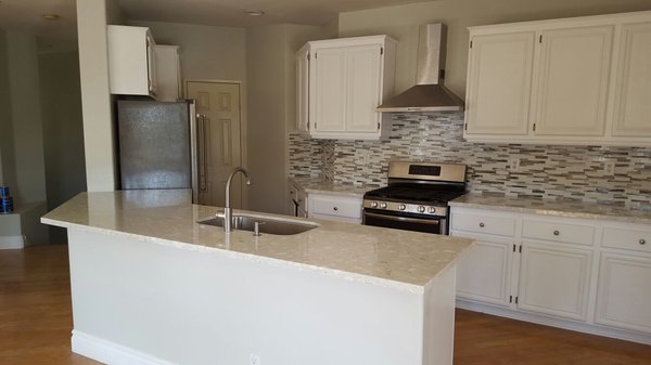 kitchen and bathroom - this kitchen was really old with a wall in the island, we removed the wall to make it open floor, new cabinets, paint and appliances