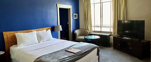Suites - Facing the forefront of our building, our Suites look out over Main Street toward Mount Wantastiquet and the Connecticut River as well as the Downtown Brattleboro area. Our Suite features 3 rooms—two bedrooms and an adjoining sitting room. Perfect for a family traveling together! Suites - Facing the forefront of our building, our Suites look out over Main Street toward Mount Wantastiquet and the Connecticut River as well as the Downtown Brattleboro area. Our Suite features 3 rooms—two bedrooms and an adjoining sitting room. Perfect for a family traveling together!
