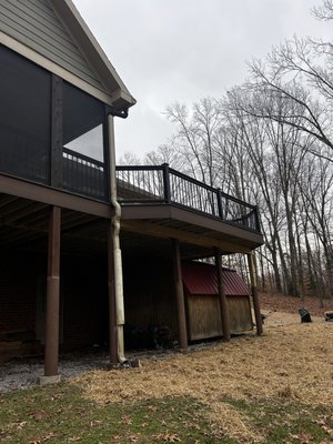 Custom TimberTech deck and porch remodel - This deck was rotten to the point of falling through, and our client wanted to make some major changes. We began by removing one of the walls of the porch and installing a beam, then ripped out all of the decking and most of the framing. We installed new framing and extended part of the deck by three feet, before installing high quality TimberTech composite decking. We also installed brand new TimberTech railing around the whole deck and porch, before finishing with new heavy duty porch screens, updated trim around the porch ceiling, and a shiplap ceiling over the porch.
