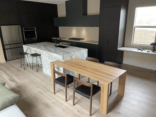 Basquze Avenue - This beautiful remodel includes modern cabinets, new flooring, and a natural stone waterfall countertop Basquze Avenue - This beautiful remodel includes modern cabinets, new flooring, and a natural stone waterfall countertop