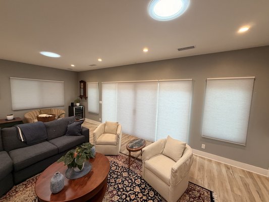 Motorized Cellular Shades in San Diego - Motorized Double-Cell Honeycomb Shades Installation in San Diego
This San Diego project featured the installation of custom motorized double-cell honeycomb shades designed to provide exceptional energy efficiency, privacy, light control, and everyday convenience. The homeowners were looking for a modern window treatment solution that would not only improve the appearance of their home but also help reduce heat transfer through their large windows while maintaining a bright and comfortable living environment.
After reviewing several window treatment options, we recommended motorized double-cell honeycomb shades due to their superior insulating properties and clean, contemporary appearance. Unlike traditional blinds or standard single-cell shades, double-cell honeycomb shades feature two layers of cellular pockets that trap air within the shade. These insulating air pockets create a thermal barrier between the window and the interior of the home, helping to reduce heat gain during warm San Diego summers and minimize heat loss during cooler months.
Many homeowners focus on window coverings primarily for privacy and light control, but windows are often one of the largest sources of energy loss within a home. The double-cell construction used in this project significantly improves insulation performance compared to many other window treatment options. By reducing solar heat transfer, these shades help maintain a more comfortable indoor temperature while reducing the workload on heating and cooling systems.
In addition to their energy-saving benefits, the shades provide excellent privacy while still allowing soft, natural light to enter the room. The light-filtering fabric gently diffuses sunlight throughout the space, reducing glare while creating a warm and inviting atmosphere. This makes them an excellent choice for living rooms, family rooms, dining areas, and other spaces where homeowners want privacy without completely blocking daylight.
For maximum convenience, these honeycomb shades were equipped with motorization, allowing effortless operation with the touch of a button. Motorized shades eliminate the need for cords and chains, creating a clean, uncluttered appearance while improving child and pet safety. The homeowner can easily raise, lower, or adjust multiple shades simultaneously using a remote control, wall switch, or smart home integration. Automated schedules can also be programmed to adjust the shades throughout the day, helping to improve comfort and energy efficiency without any manual operation.
The sleek design of the cellular shades complements the home's modern interior while maintaining a minimal profile when raised. The fabric color was carefully selected to blend seamlessly with the existing décor and maximize natural light while preserving privacy. The result is a window treatment solution that combines style, performance, and convenience in one elegant package.
At iL Progetto Shades & Blinds, we brought our mobile showroom directly to the homeowner, allowing them to compare fabrics, colors, opacity levels, and motorization options in their own lighting conditions. After completing detailed measurements, we custom-manufactured the shades to ensure a precise fit and professional finish.
The finished installation transformed the space, delivering improved comfort, energy efficiency, privacy, and modern functionality. These motorized double-cell honeycomb shades are an excellent investment for homeowners looking to reduce heat transfer, improve insulation, enhance privacy, and enjoy the convenience of automated window treatments.
Project Highlights:
• Custom Motorized Double-Cell Honeycomb Shades
• Superior Thermal Insulation
• Enhanced Energy Efficiency
• Light Filtering Privacy Fabric
• Cordless Child-Safe Design
• Smart Home & Remote Control Operation
• Reduced Solar Heat Gain
• Improved Indoor Comfort Year-Round
• Clean, Modern Appearance
Location:
San Diego, California
