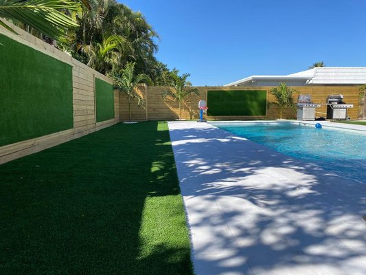 Aventura FL - This project was done around the pool and the customer wanted a lawn that looks very natural, so we chose the Cool Diamond grass type. In addition, stones and palm trees and part of the grass wall were placed. Aventura FL - This project was done around the pool and the customer wanted a lawn that looks very natural, so we chose the Cool Diamond grass type. In addition, stones and palm trees and part of the grass wall were placed.