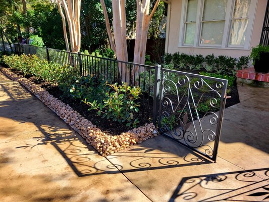 Monte Vista Front Yard Project - Client had a vision of creating privacy and security for their front yard, unfortunately their old shrubs weren't cutting it. We removed all of the dead/dying shrubs and replaced them with fast growing; low maintenance shrubs so they will be able to keep them at any desired height. In between those shrubs we installed a new wright iron fence for added security. Up against the sidewalk we replaced the jasmine with a rock boarder to better keep the mulch and vegetation from spilling out onto the sidewalk. Property needed minor irrigation repair, which we were licensed to handle, and we set up their drip system to properly water the newly planted shrubs and flowers. Up against the house the client was not happy with plant selection from the previous landscaper, so we changed the area out! We added medium height; low maintenance shrubs, low lying flowering plants in front, and then seasonal flower areas for added color. Included with this project was a full front yard cleanup and re-mulching. Monte Vista Front Yard Project - Client had a vision of creating privacy and security for their front yard, unfortunately their old shrubs weren't cutting it. We removed all of the dead/dying shrubs and replaced them with fast growing; low maintenance shrubs so they will be able to keep them at any desired height. In between those shrubs we installed a new wright iron fence for added security. Up against the sidewalk we replaced the jasmine with a rock boarder to better keep the mulch and vegetation from spilling out onto the sidewalk. Property needed minor irrigation repair, which we were licensed to handle, and we set up their drip system to properly water the newly planted shrubs and flowers. Up against the house the client was not happy with plant selection from the previous landscaper, so we changed the area out! We added medium height; low maintenance shrubs, low lying flowering plants in front, and then seasonal flower areas for added color. Included with this project was a full front yard cleanup and re-mulching.