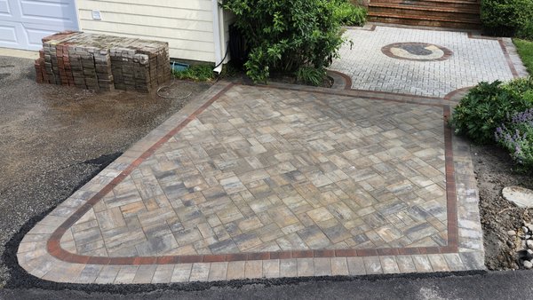 Paver Entry Way - This Paver Entryway was designed and installed in Deale, Maryland in 2025 in response to a clients request for more parking and outdoor space for parties. The client also asked for custom paver art. Paver Entry Way - This Paver Entryway was designed and installed in Deale, Maryland in 2025 in response to a clients request for more parking and outdoor space for parties. The client also asked for custom paver art.