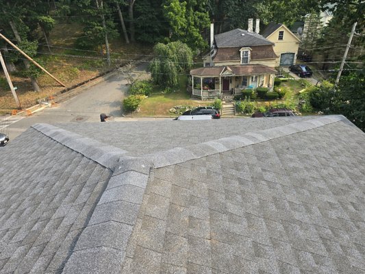 Mansard Style Roof Replacement - Replacement of shingles on mansard style roof using the proper stagings and safety equipment. Counter flashing replaced on all windows and dormers using aluminum and weather barrier.