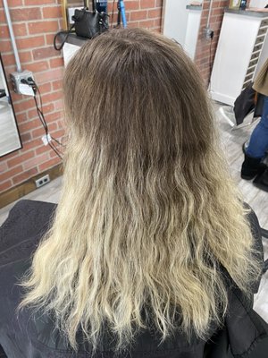 Heavy Foil Transformation! - This client came to us with 6 months of re-growth wanting to go blonde again! So we decided on a full, heavy foil, toner, haircut and blowout to achieve this look!