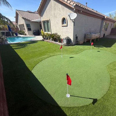 Putting Green & Turf Combo - This backyard blends a custom putting green with lush artificial turf to create a space that’s both beautiful and fully functional. The layout keeps the yard open and inviting while adding a fun feature that can be enjoyed year-round. Putting Green & Turf Combo - This backyard blends a custom putting green with lush artificial turf to create a space that’s both beautiful and fully functional. The layout keeps the yard open and inviting while adding a fun feature that can be enjoyed year-round.