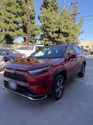 Toyota RAV4 Front-End Collision Repair - This Toyota RAV4 came in with front-end collision damage: bumper, headlight area and front fender. We repaired the damage, replaced the broken parts, and painted and color-matched the panels in our paint booth. The RAV4 left our shop looking like new.