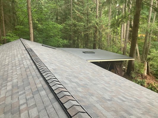 Malarkey Shingles Roof Makeover - Greetings from Redmond WA! We recently completed a remarkable roof makeover, converting a metal and clear panel roof into a stunning Malarkey shingles masterpiece. Here's how we did it:
1️⃣ Removed old panels
2️⃣ Strengthened support system
3️⃣ Upgraded to Full CDX plywood
4️⃣ Added synthetic underlayment
5️⃣ Installed Malarkey shingles
Why Malarkey Shingles? Here are the highlights:
✅ Durable
✅ Energy-efficient
✅ Aesthetic options
✅ Environmentally responsible
