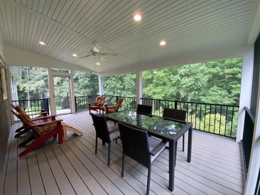 Deck/Screen Porch With a Shed Style Roof - This is a Deck/Screen Porch with a shed style roof. For this project we use Trex Transcend Gravel Path Grey Decking with Trex Transcends 4 1/2″ x 4 1/2″ white composite posts with Trex Signature All black powder coated aluminum railings running between them. The Screen System is called Screeneze and we wrapped the roof support posts in white vinyl trim to match the style of the railing posts. We also installed white vinyl vented soffit material as the ceiling in which the venting is in the grooves hide the visibility and allow the ceiling to look similar to a tongue and groove white painted ceiling. Deck/Screen Porch With a Shed Style Roof - This is a Deck/Screen Porch with a shed style roof. For this project we use Trex Transcend Gravel Path Grey Decking with Trex Transcends 4 1/2″ x 4 1/2″ white composite posts with Trex Signature All black powder coated aluminum railings running between them. The Screen System is called Screeneze and we wrapped the roof support posts in white vinyl trim to match the style of the railing posts. We also installed white vinyl vented soffit material as the ceiling in which the venting is in the grooves hide the visibility and allow the ceiling to look similar to a tongue and groove white painted ceiling.