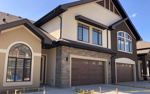 Quarry Park Stucco - This is our largest project in Quarry Park, completed in 2019.
We installed conventional stucco system on all 24 units of townhomes, plastered over 40k SQFT of wall area in total.
The conventional stucco system includes: all drip flashings, sealing all windows and doors, 2 layers of building tar paper, stucco wire, scratch coat (sand and cement), second coat of stucco, acrylic finish. Quarry Park Stucco - This is our largest project in Quarry Park, completed in 2019.
We installed conventional stucco system on all 24 units of townhomes, plastered over 40k SQFT of wall area in total.
The conventional stucco system includes: all drip flashings, sealing all windows and doors, 2 layers of building tar paper, stucco wire, scratch coat (sand and cement), second coat of stucco, acrylic finish.