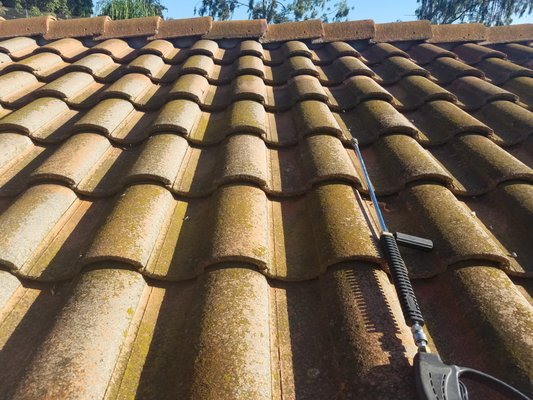 Spanish Tile Roof  Cleaning Removed Green Algae - Pressure washed Spanish Tile Roof! Over time when water sits on your roof it create a Algae build up, it happen a lot on the side where water doesn't Dry. Very important to keep your Roof Clean, There's a technic we use to kill the algae on your Roof!