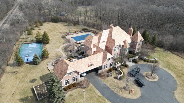 Cedar Shake Roof replacement in Barrington Hills IL - Full cedar shake replacement along with update of all the copper components, metal flashing and gutter replacement.