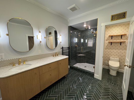 Master bathroom remodel - Complete Bathroom Transformation:
This bathroom remodel took a once cramped and outdated space and turned it into a modern oasis, combining functionality with style. The project included significant improvements to the shower, toilet closet, vanity area, and overall design to enhance both the look and feel of the room.
Shower & Toilet Closet Expansion:
The shower and toilet closet, previously dark and confined, were expanded to create a more open, inviting atmosphere. The updated shower features modern fixtures, adding both comfort and a sleek aesthetic to the space. The increased size of the toilet closet enhances convenience without compromising on design.
Luxurious Soaking Tub & Updated Vanity:
A new luxurious soaking tub was installed, providing a perfect spot for relaxation. The vanity area, which had been dark and cramped, was completely revamped with a fresh new design. A stylish vanity featuring crown molding and custom details brings an elegant touch, while improved lighting ensures the space feels bright and open.
Modern Fixtures, Flooring, & Tile Upgrades:
The bathroom now boasts fresh flooring, replacing the cracked tiles that previously detracted from the space. With the new modern fixtures, including an upgraded tub faucet, every element now contributes to a sleek and cohesive design.
New Paint, Molding, & Finishing Touches:
To complete the transformation, the entire bathroom received a fresh coat of paint, bringing in a clean, updated look. New crown molding and baseboards were added to enhance the architectural details of the room. Updated mirrors and lighting fixtures further brighten and modernize the space, making it feel larger and more luxurious.
This remodel not only improved the bathroom's aesthetics but also enhanced its functionality, turning it into a bright, welcoming space that balances both comfort and style. Master bathroom remodel - Complete Bathroom Transformation:
This bathroom remodel took a once cramped and outdated space and turned it into a modern oasis, combining functionality with style. The project included significant improvements to the shower, toilet closet, vanity area, and overall design to enhance both the look and feel of the room.
Shower & Toilet Closet Expansion:
The shower and toilet closet, previously dark and confined, were expanded to create a more open, inviting atmosphere. The updated shower features modern fixtures, adding both comfort and a sleek aesthetic to the space. The increased size of the toilet closet enhances convenience without compromising on design.
Luxurious Soaking Tub & Updated Vanity:
A new luxurious soaking tub was installed, providing a perfect spot for relaxation. The vanity area, which had been dark and cramped, was completely revamped with a fresh new design. A stylish vanity featuring crown molding and custom details brings an elegant touch, while improved lighting ensures the space feels bright and open.
Modern Fixtures, Flooring, & Tile Upgrades:
The bathroom now boasts fresh flooring, replacing the cracked tiles that previously detracted from the space. With the new modern fixtures, including an upgraded tub faucet, every element now contributes to a sleek and cohesive design.
New Paint, Molding, & Finishing Touches:
To complete the transformation, the entire bathroom received a fresh coat of paint, bringing in a clean, updated look. New crown molding and baseboards were added to enhance the architectural details of the room. Updated mirrors and lighting fixtures further brighten and modernize the space, making it feel larger and more luxurious.
This remodel not only improved the bathroom's aesthetics but also enhanced its functionality, turning it into a bright, welcoming space that balances both comfort and style.