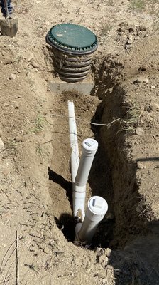 Septic line repair - Septic tank needed the inlet pipe replaced and resealed to tank. Added new access point for future drain cleaning when needed.