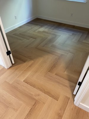 Waterproof Herringbone SPC - Gaia Red Series - Our crew had the pleasure of working with this beautiful herringbone pattern SPC from Gaia. It was installed throughout the first floor, and matching non-herringbone planks were used on the stairs and the second floor. (Product: Gaia Red Series - Bella Salla)
