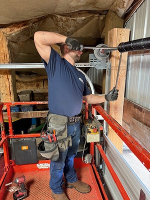 Garage Door Spring Repair - When a garage door spring breaks it can leave your door inoperable. While replacing a spring might seem like a straightforward task, improper handling can lead to serious, even fatal injuries. Broken garage door springs can still hold immense force which must be carefully released during the removal process. A sudden release of pressure can send the spring flying with enough power to cause severe harm. Protect yourself and your loved ones by calling Muhly’s Garage Doors for safe and professional spring replacement.