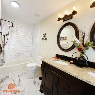 Bathroom Renovation! - This was the second bathroom renovation in this house. We removed a dividing wall between shower and vanity, We connected both spaced and it looks so much more spacious and beautiful now! We took care of everything from plumbing to the subway tile installation, flooring, painting and even this beautiful doble vanity and light features installation. Our client absolutely loved it!