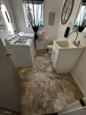 Bathroom Leak Repair & Flooring Update - The toilet was leaking and caused floor damage throughout the laundry bathroom. I fixed the leak, removed all old flooring, cleaned the subfloor, and installed new vinyl flooring. The room now looks fresh and updated.