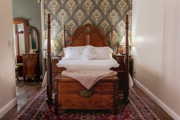 Bully Choop - Room 3 - Sink into the elegant romanticism of yesteryear in the Bully Choop suite at the Weaverville Hotel, complete with a poster queen-sized bed, a dedicated workspace, and quiet sitting area in front of the fireplace. Indulge in the tucked-away champagne tub.
The Bully Choop is ideal for solo travelers or couples looking to spend quality time in the quiet beauty of the Trinity Alps. With over 600 ft2 of living area, Bully Choop is spacious and the perfect base for a day or a week.
Bully Choop is part of the Weaverville Hotel at the base of the stunning Trinity Alps. Enjoy easy access to hikes, fishing, lakes, mountains and more, making it the perfect base for all your North State adventures.
This room features:
- A queen-sized poster bed
- A lounge area with two classy high-back chairs in front of an in-room gas fireplace, complete with your own coffee station
- High speed internet
- A writing desk
- Jetted champagne tub
- Access to a shared parlor space (open from 8 a.m. — 10 p.m.) Bully Choop - Room 3 - Sink into the elegant romanticism of yesteryear in the Bully Choop suite at the Weaverville Hotel, complete with a poster queen-sized bed, a dedicated workspace, and quiet sitting area in front of the fireplace. Indulge in the tucked-away champagne tub.
The Bully Choop is ideal for solo travelers or couples looking to spend quality time in the quiet beauty of the Trinity Alps. With over 600 ft2 of living area, Bully Choop is spacious and the perfect base for a day or a week.
Bully Choop is part of the Weaverville Hotel at the base of the stunning Trinity Alps. Enjoy easy access to hikes, fishing, lakes, mountains and more, making it the perfect base for all your North State adventures.
This room features:
- A queen-sized poster bed
- A lounge area with two classy high-back chairs in front of an in-room gas fireplace, complete with your own coffee station
- High speed internet
- A writing desk
- Jetted champagne tub
- Access to a shared parlor space (open from 8 a.m. — 10 p.m.)