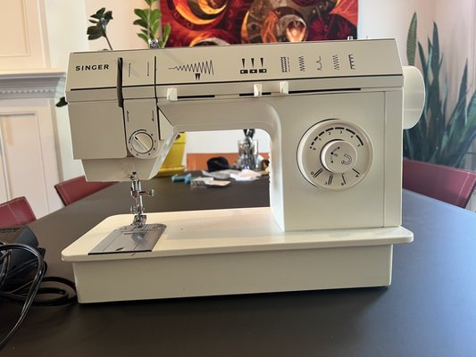 Singer 5705 Repair - The test sew before working on the machine showed lots of looping and unevenness. We cleaned out years worth of hardened grease and buildup. We also realigned the presser foot and replaced a broken bobbin case. Sewing beautifully again! Singer 5705 Repair - The test sew before working on the machine showed lots of looping and unevenness. We cleaned out years worth of hardened grease and buildup. We also realigned the presser foot and replaced a broken bobbin case. Sewing beautifully again!