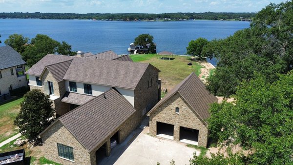 Lakefront Cedar Shake - This lake house was a new construction home that we roofed in August 2025. This is Brava’s Cedar Shake profile in their Natural Cedar color and was completed alongside TPO roofing on some areas of the roof. Paying close attention to transition details is paramount for a job like this and we are ecstatic to know that this roof will look gorgeous for decades on this lakefront property! Lakefront Cedar Shake - This lake house was a new construction home that we roofed in August 2025. This is Brava’s Cedar Shake profile in their Natural Cedar color and was completed alongside TPO roofing on some areas of the roof. Paying close attention to transition details is paramount for a job like this and we are ecstatic to know that this roof will look gorgeous for decades on this lakefront property!