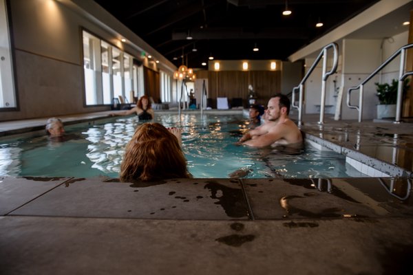 Bathhouse - Our modern bathhouse offers a communal gathering place to restore wellbeing through the healing elements of water + hot and cold contrast therapy — designed to balance, energize, and restore.

Soak — Relaxing and nourishing for the body and mind.
Sauna + Steam — Cleansing and soothing, helping to release tension and detoxify.
Cold Plunge — Energizing and healing, reducing inflammation, boosting circulation and vitality.
Lounge — Enjoy quality time alone or with friends in our peaceful communal space.
Relax — Add massage, salt therapy, sound immersion, or DIY skin care to deepen your experience.
Unplug — Leave technology behind and reconnect — with yourself, with others, and with the present moment.