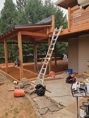 2020 2 story deck - Camas Washington - This was a complete remodel of an old deck. We built a custom cover wrapped in cedar and dried in the second story deck. Complete custom rails and black hardware connections. We added electrical outlets, lights, and a ceiling fan to complete the outdoor living space. 2020 2 story deck - Camas Washington - This was a complete remodel of an old deck. We built a custom cover wrapped in cedar and dried in the second story deck. Complete custom rails and black hardware connections. We added electrical outlets, lights, and a ceiling fan to complete the outdoor living space.
