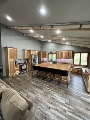 Kitchen Remodel 2023 - This remodel was done on an old kitchen that was in bad shape. The rest of the house had been updated so the kitchen stuck out like a sore thumb. We gutted the kitchen and installed new hickory cabinets with oak butcher block tops that were reclaimed out of pews from a local church. This look really compliments the rustic farmhouse look the customers wanted! There are some finishing touches that need to be wrapped up but the home is looking great so far! We guarantee superior quality and exceptional craftsmanship! Give us a call for all of your construction needs. Kitchen Remodel 2023 - This remodel was done on an old kitchen that was in bad shape. The rest of the house had been updated so the kitchen stuck out like a sore thumb. We gutted the kitchen and installed new hickory cabinets with oak butcher block tops that were reclaimed out of pews from a local church. This look really compliments the rustic farmhouse look the customers wanted! There are some finishing touches that need to be wrapped up but the home is looking great so far! We guarantee superior quality and exceptional craftsmanship! Give us a call for all of your construction needs.
