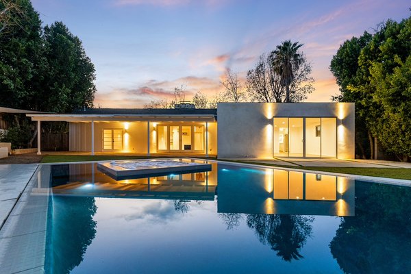 The Vista Oro Project | Pool & Spa Construction - Welcome to the Vista Oro Project in Palo Alto, CA.

Situated on a spacious half-acre lot, our clients wanted a sleek, modern backyard featuring a statement pool and spa. We designed and built a zero-edge pool paired with an infinity spa, seamlessly blending luxury and functionality.

This project features top-of-the-line amenities, including a high-performance heating system, spa jets, and color-changing LED pool lights to create a dynamic ambiance. To enhance its contemporary aesthetic, we incorporated porcelain tile coping with a square-edged (straight edge) finish, offering a clean, minimalistic look. The precise arrangement of tight grout lines ensures a seamless and polished appearance, elevating the overall design.

The result? A stunning, resort-style oasis that perfectly complements the modern architecture of the home.