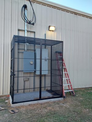 Electrical Equipment Protection Cage - Dollar General contacted us regarding ongoing issues with unauthorized individuals tampering with their exterior electrical equipment. We provided a rapid turnaround solution to improve safety and security by installing a reinforced exterior enclosure set in cement and constructed with heavy-duty metal, equipped with a lock accessible only to authorized personnel. This installation effectively secures the equipment and prevents unwanted access.