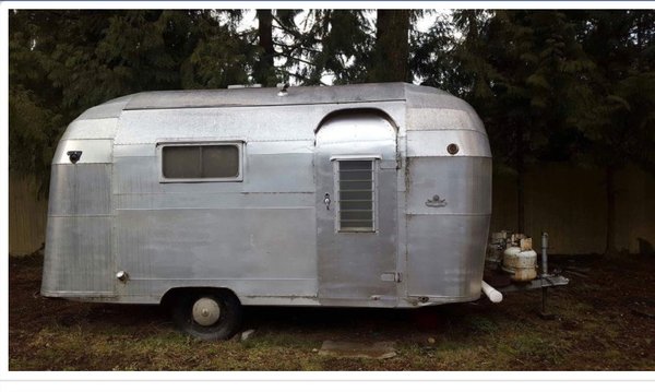 Silver Streak Chico - This rare Silver Streak Chico is one of a handful made. This trailer lives in Tacoma WA and was completely restored. Sealed from the interior, new insulation, wiring, original metal walls were reinstalled, we added the original sink and stove but enlarged the kitchen cabinet to accommodate for a fridge. The cute little corner fireplace was added to the empty corner and we think it adds a nice cabin like feel. This client purchased the unit with the intention of having it restored. Silver Streak Chico - This rare Silver Streak Chico is one of a handful made. This trailer lives in Tacoma WA and was completely restored. Sealed from the interior, new insulation, wiring, original metal walls were reinstalled, we added the original sink and stove but enlarged the kitchen cabinet to accommodate for a fridge. The cute little corner fireplace was added to the empty corner and we think it adds a nice cabin like feel. This client purchased the unit with the intention of having it restored.