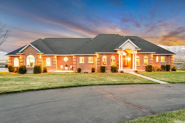 Beautiful home in Payson - This is a once in a lifetime opportunity to own a premium estate with breathtaking panoramic views of the Wasatch Range from every main room in the house. Imagine friends and family driving up the tree-lined drive to your classic, columned entry. Open the huge custom Cherrywood door to the great room with an arched wall of windows framing dramatic mountain vistas that elicit admiration from every guest. The grand oversized fireplace warms the gracious living/formal dining area with two sets of French doors to the incredible gourmet kitchen with two dishwashers, Viking gas range, two sinks and a large island completely surrounded by custom cabinetry and granite counters. This home easily hosts extensive family or friends for a gracious, active lifestyle. Custom pantry and extensive mudroom off of a fantastic laundry room make the active lifestyle a breeze Beautiful home in Payson - This is a once in a lifetime opportunity to own a premium estate with breathtaking panoramic views of the Wasatch Range from every main room in the house. Imagine friends and family driving up the tree-lined drive to your classic, columned entry. Open the huge custom Cherrywood door to the great room with an arched wall of windows framing dramatic mountain vistas that elicit admiration from every guest. The grand oversized fireplace warms the gracious living/formal dining area with two sets of French doors to the incredible gourmet kitchen with two dishwashers, Viking gas range, two sinks and a large island completely surrounded by custom cabinetry and granite counters. This home easily hosts extensive family or friends for a gracious, active lifestyle. Custom pantry and extensive mudroom off of a fantastic laundry room make the active lifestyle a breeze