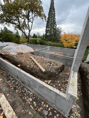 Bellevue Foundation [BIG] - A formed and poured Foundation that features stunning concrete work. The snap tie holes that can be seen on the walls were carefully picked and measured to ensure that the clients Vision was in place. It took a longer amount of time because of revisions but we wanted to make it perfect!