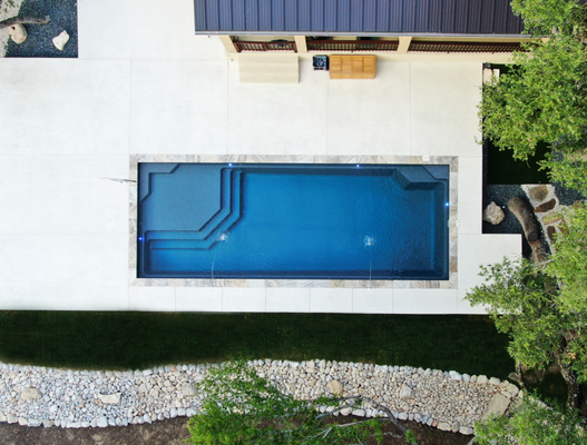 Holmstrand - Vogue 40 in Gibraltar Grey pool finish with Silver Travertine coping. Holmstrand - Vogue 40 in Gibraltar Grey pool finish with Silver Travertine coping.