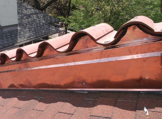 Copper Roofing - No Historical Roof Is Complete Without Copper Gutters, Downspouts, and Valley Flashings.
The roofing professionals at Todco Roofing are the Chicago area’s historical roof restoration experts. Restoring a tile, slate, copper or metal roof is only part of the job. That’s why Todco Roofing also specializes in the custom fabrication of copper gutters, flashings, bay roofs, downspouts and other decorative metalwork that makes a truly historical roof stand out. The roof restoration experts at Todco Roofing understand that an historical roof is more than just roofing material. Often, the architectural details of a home’s roofline distinguish it from other homes in the area, and make a home truly unique. Unfortunately, these one-of-a-kind treasures wear and age. Our staff experts can deliver the custom fabrication of copper gutters, flashings, bay roofs, and downspouts your home requires. In most cases, these stylish roof details are actually integral parts of the roof’s drainage and water flow management system and should be maintained just as the actual roofing materials and support structures are maintained. In addition to providing function, these elements enhance the beauty and value of your home. Their expense is justified because a properly maintained roof will increase the historical value and significance of your home and ensure that the roof will remain viable for years to come. Copper Roofing - No Historical Roof Is Complete Without Copper Gutters, Downspouts, and Valley Flashings.
The roofing professionals at Todco Roofing are the Chicago area’s historical roof restoration experts. Restoring a tile, slate, copper or metal roof is only part of the job. That’s why Todco Roofing also specializes in the custom fabrication of copper gutters, flashings, bay roofs, downspouts and other decorative metalwork that makes a truly historical roof stand out. The roof restoration experts at Todco Roofing understand that an historical roof is more than just roofing material. Often, the architectural details of a home’s roofline distinguish it from other homes in the area, and make a home truly unique. Unfortunately, these one-of-a-kind treasures wear and age. Our staff experts can deliver the custom fabrication of copper gutters, flashings, bay roofs, and downspouts your home requires. In most cases, these stylish roof details are actually integral parts of the roof’s drainage and water flow management system and should be maintained just as the actual roofing materials and support structures are maintained. In addition to providing function, these elements enhance the beauty and value of your home. Their expense is justified because a properly maintained roof will increase the historical value and significance of your home and ensure that the roof will remain viable for years to come.