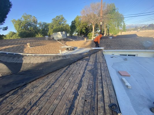Roof Repair in San Bernardino - Major wind damage to this roof it actually blew off the torch down material and damaged 2 turbines. We went out for an inspection and submitted the itemized estimate for the client to send to their insurance. Here are the progress photos. Please call us if you need any help with your roof, we are efficient with what we do.