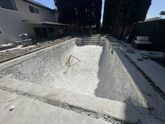 Northridge Pool Remodel - This pool remodel featured a beautiful Aqua Blue Mini Pebble finish, brand-new waterline tile, a new skimmer, and new pool return lines to improve both appearance and performance. To finish it off, new turf grass was installed to give the entire backyard a clean, modern look. The result is a fresh outdoor space ready to enjoy year-round. 💦🌴