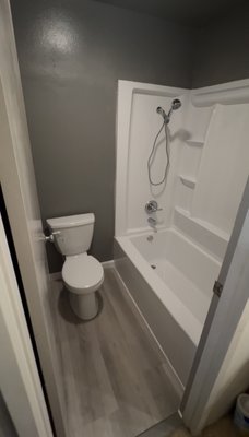 Bathroom remodel. - The bathroom remodel involved a full demolition of the existing fixtures and finishes, including the removal of the old toilet, bathtub, wall materials, and outdated plumbing fixtures. A new toilet and bathtub were installed, along with updated walls and fresh paint to revitalize the space. A new shower valve was also installed to improve water control and reliability. The project enhances both the functionality and appearance of the bathroom, resulting in a clean, modern, and fully updated space. Bathroom remodel. - The bathroom remodel involved a full demolition of the existing fixtures and finishes, including the removal of the old toilet, bathtub, wall materials, and outdated plumbing fixtures. A new toilet and bathtub were installed, along with updated walls and fresh paint to revitalize the space. A new shower valve was also installed to improve water control and reliability. The project enhances both the functionality and appearance of the bathroom, resulting in a clean, modern, and fully updated space.